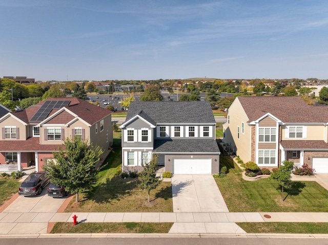 view of front of home with a garage and a front lawn