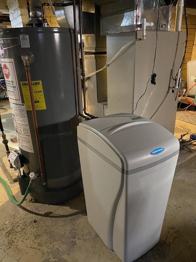 utility room featuring water heater