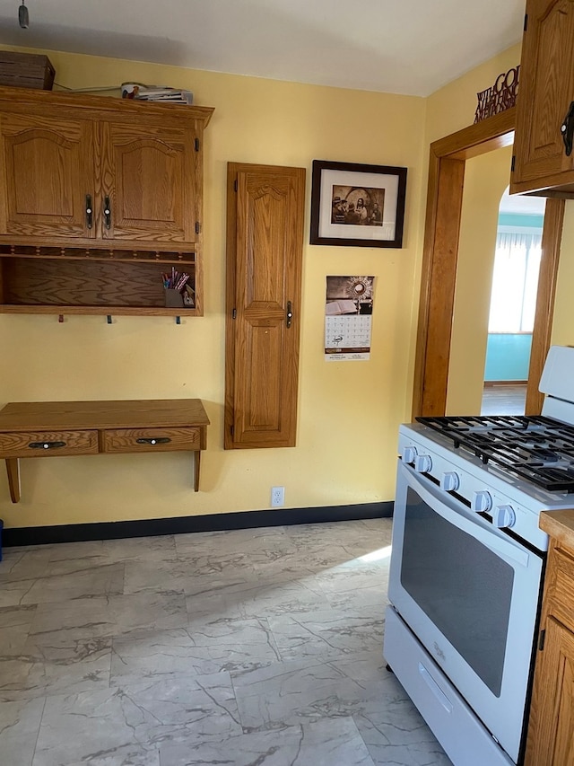 kitchen with white gas stove