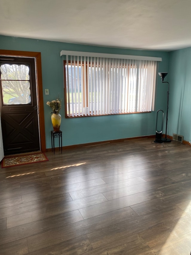 entryway with dark hardwood / wood-style floors