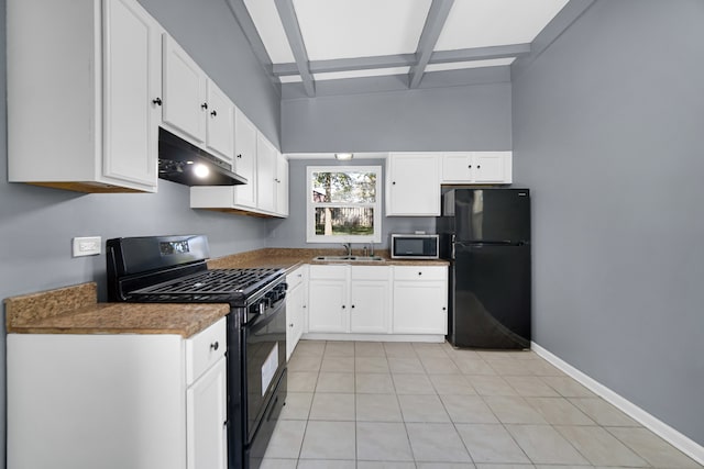 kitchen with beam ceiling, sink, black appliances, light tile patterned floors, and white cabinetry