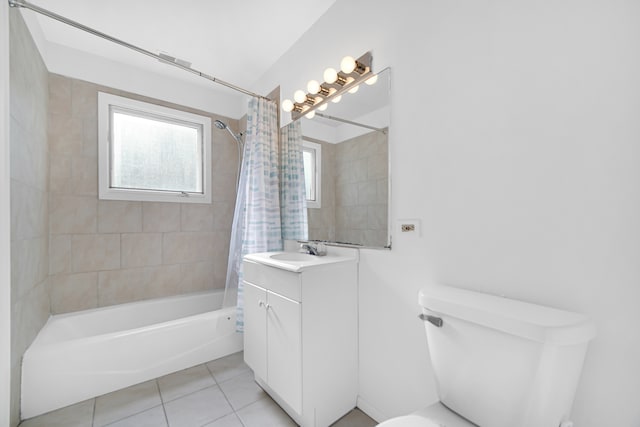 full bathroom featuring vanity, shower / bath combo with shower curtain, toilet, and tile patterned flooring