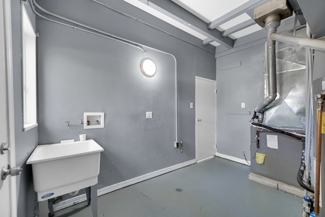 utility room featuring heating unit