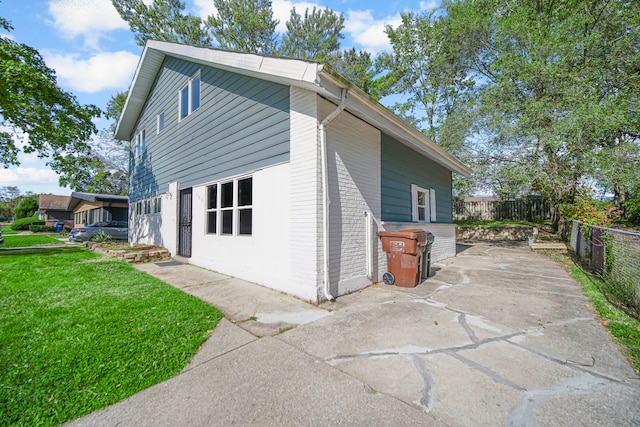 view of property exterior featuring a yard