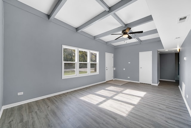 unfurnished room featuring lofted ceiling with beams, ceiling fan, and hardwood / wood-style floors