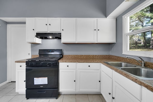 kitchen with white cabinets, sink, gas stove, and exhaust hood