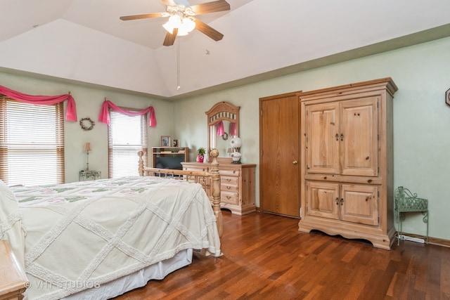 bedroom with ceiling fan, lofted ceiling, and dark hardwood / wood-style floors