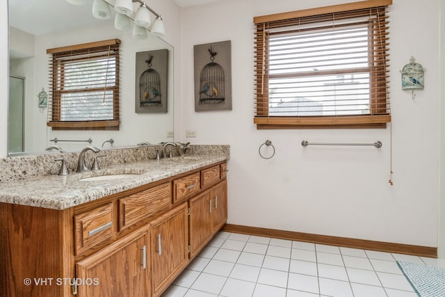 bathroom featuring tile patterned flooring and vanity