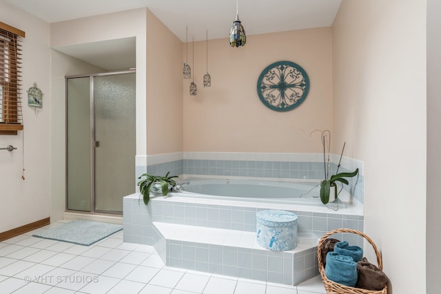 bathroom featuring shower with separate bathtub