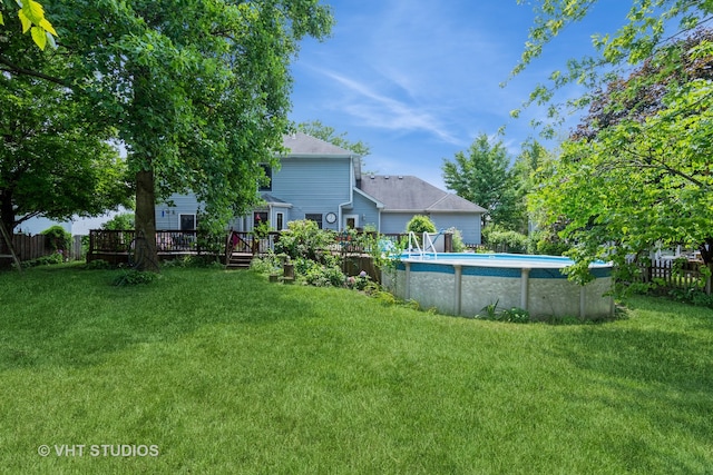 view of yard featuring a swimming pool side deck