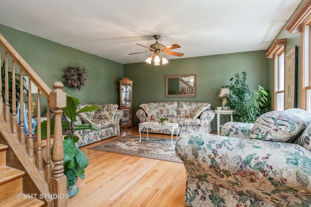 living room with hardwood / wood-style floors and ceiling fan