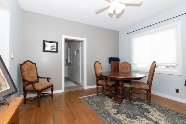 dining space featuring ceiling fan and hardwood / wood-style flooring