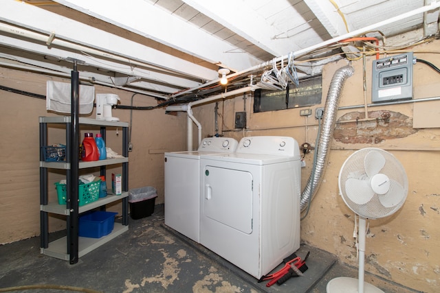 washroom with washing machine and clothes dryer