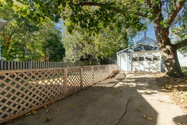 exterior space with a garage and an outdoor structure