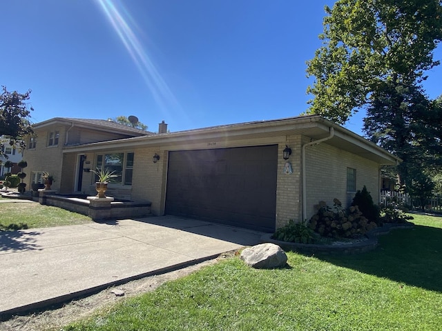 single story home with a garage and a front lawn