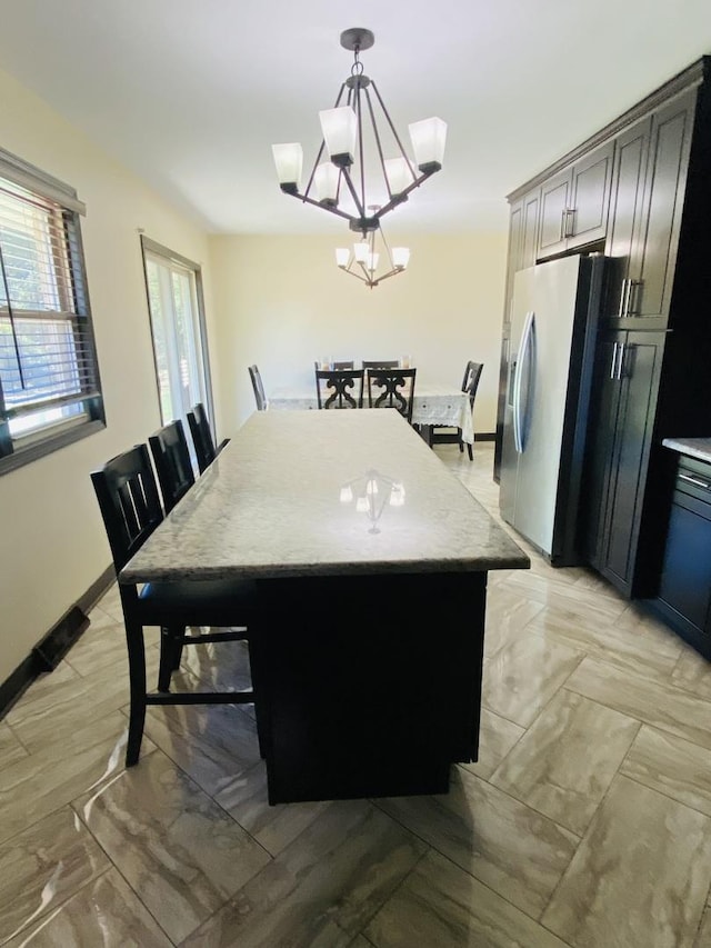 dining room featuring a notable chandelier