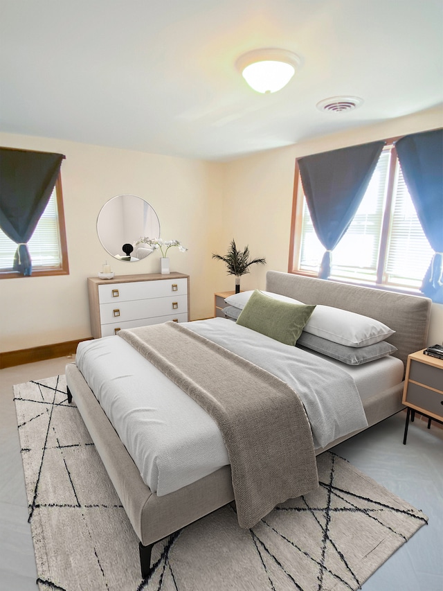 bedroom featuring multiple windows