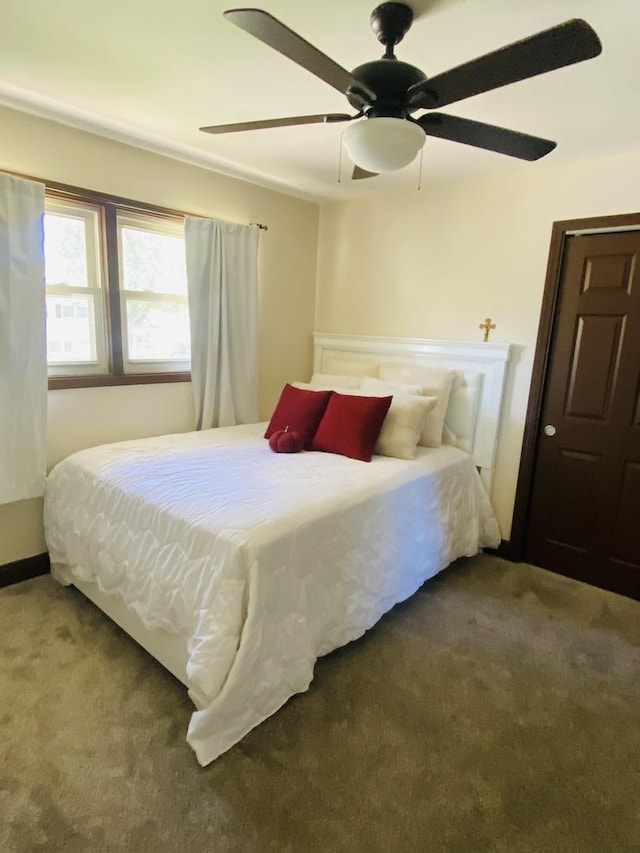 carpeted bedroom featuring ceiling fan