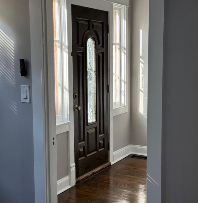 entrance foyer with dark hardwood / wood-style floors