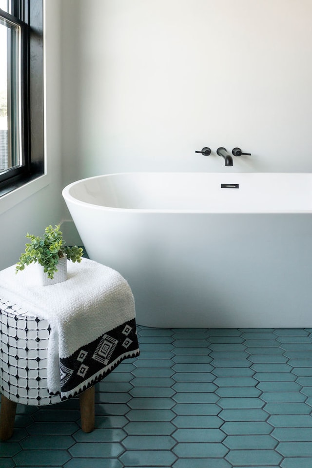 bathroom featuring a bathtub and tile patterned flooring