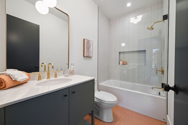 full bathroom with vanity, toilet, and tiled shower / bath