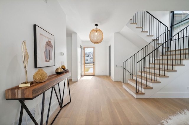 foyer entrance with light wood-type flooring