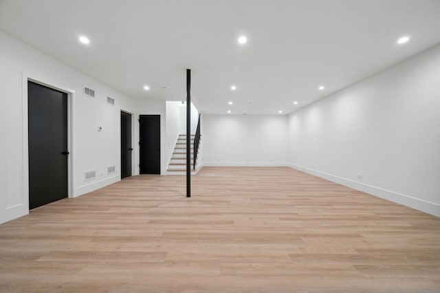 basement featuring light hardwood / wood-style flooring