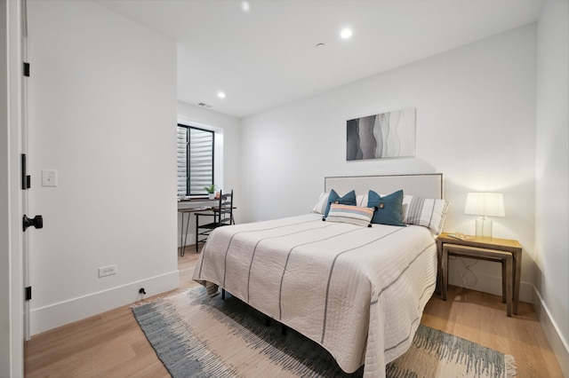 bedroom featuring light hardwood / wood-style floors