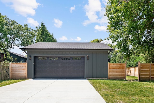 garage featuring a lawn