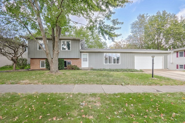 view of front facade featuring a garage and a front lawn