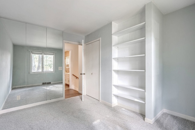 unfurnished bedroom featuring carpet floors