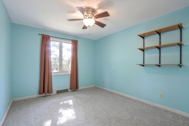 unfurnished room featuring ceiling fan and carpet flooring