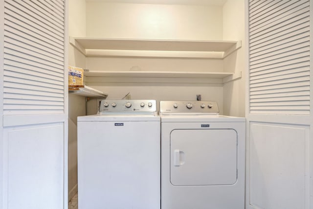 clothes washing area with washer and dryer