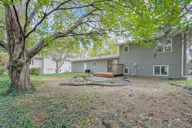 back of house featuring a deck