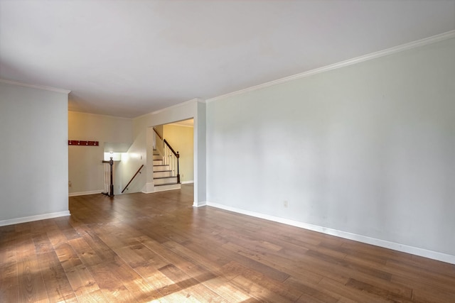 unfurnished room featuring crown molding and hardwood / wood-style floors