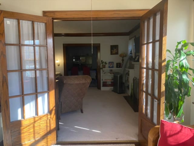 interior space featuring carpet flooring and french doors