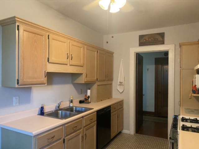 kitchen with dishwasher, sink, white gas range, ceiling fan, and light brown cabinetry