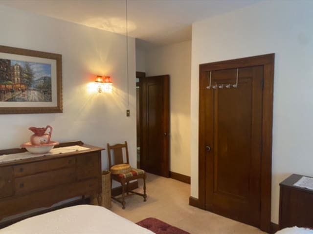bedroom featuring light carpet