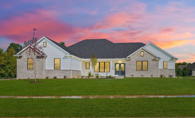 view of front of house with a lawn