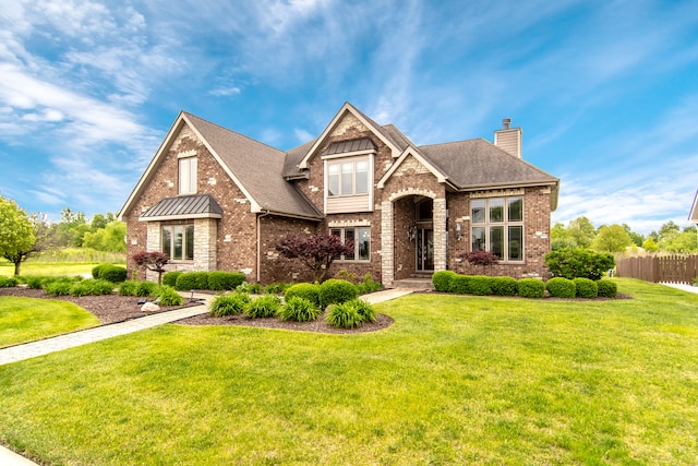 view of front of home featuring a front lawn