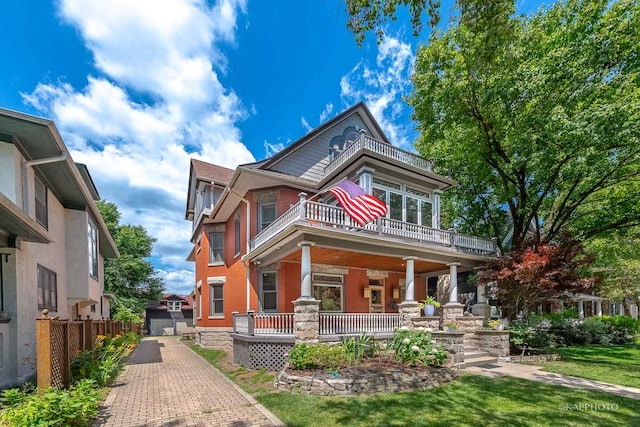 view of front of house featuring a front yard and a porch