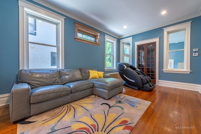 living room featuring ornamental molding and hardwood / wood-style floors