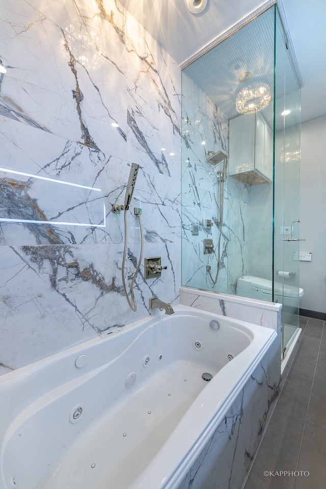 bathroom featuring shower with separate bathtub, tile patterned flooring, and toilet