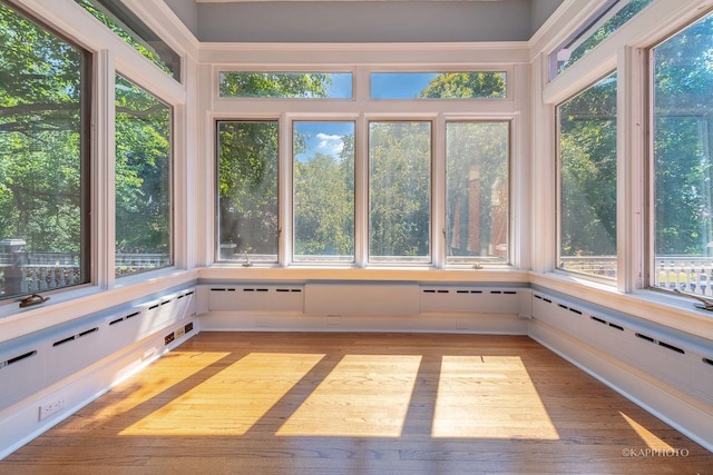 unfurnished sunroom featuring plenty of natural light