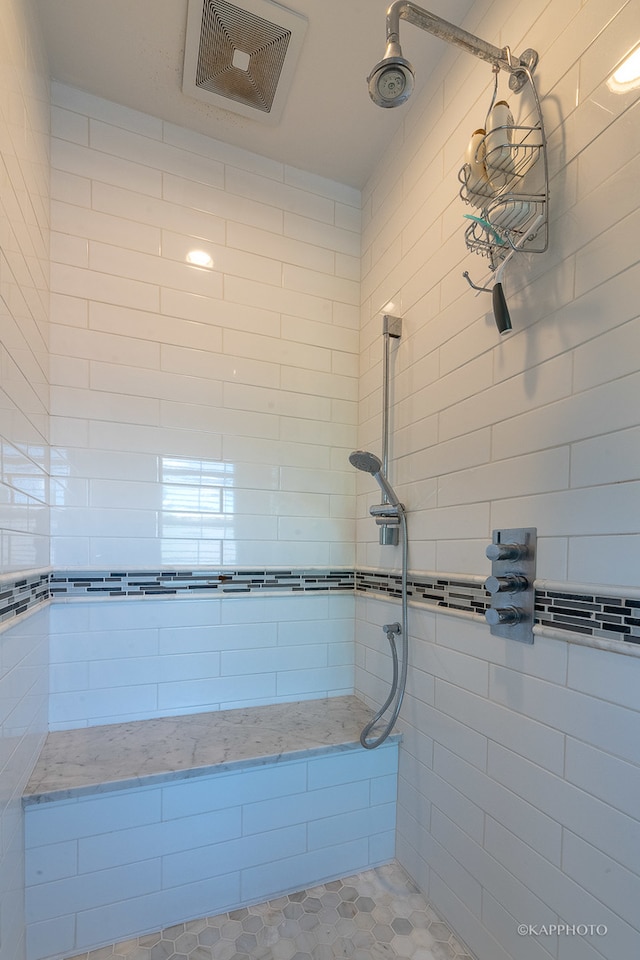 bathroom with a tile shower