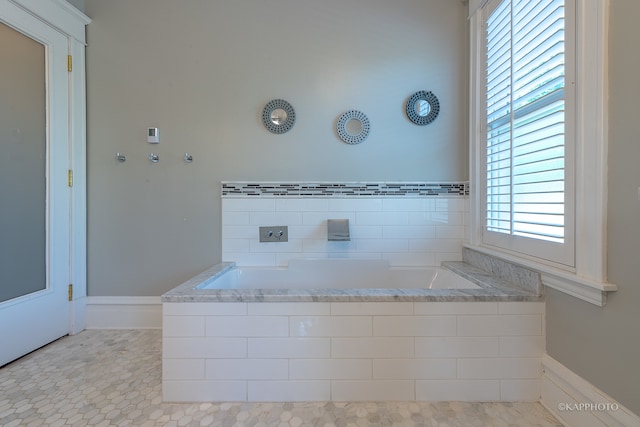 bathroom featuring a bath and tile patterned flooring