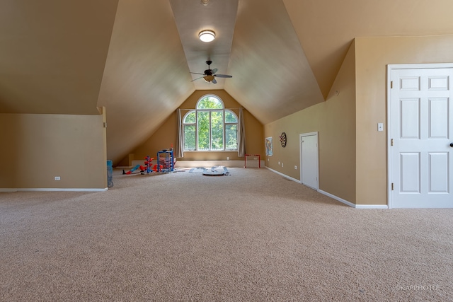 recreation room featuring carpet, lofted ceiling, and ceiling fan