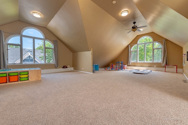 playroom with carpet, vaulted ceiling, and ceiling fan