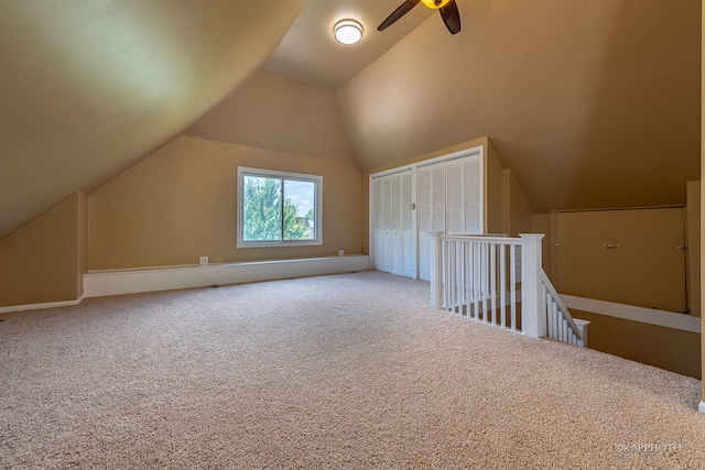 additional living space with carpet floors, vaulted ceiling, and ceiling fan