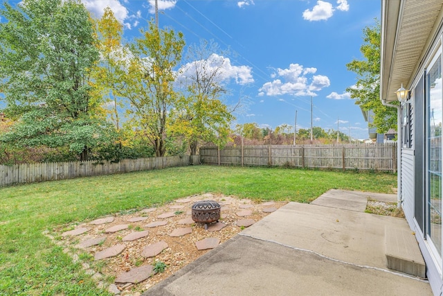 view of yard featuring a patio area and a fire pit